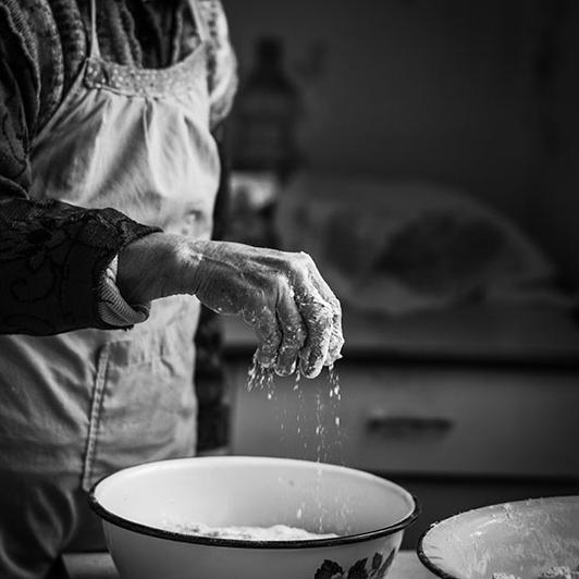 Vintage photo of older family member cooking vegetarian food